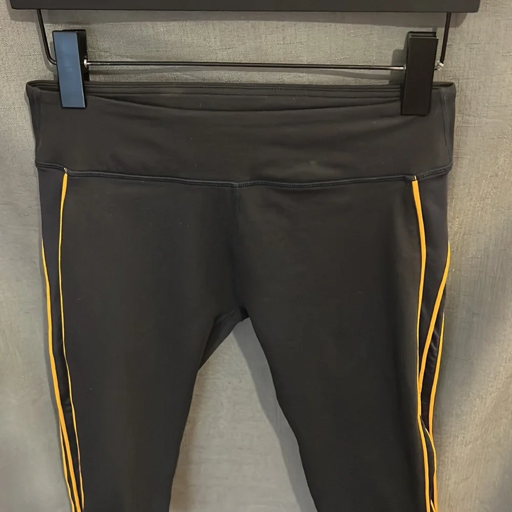 Fabletics Black Capri Leggings with Orange Piping